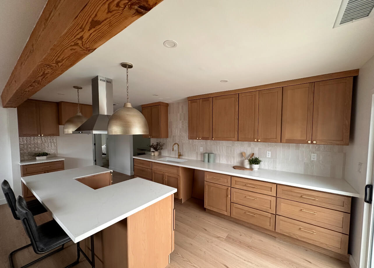 Modern kitchen with wooden cabinets and white countertops